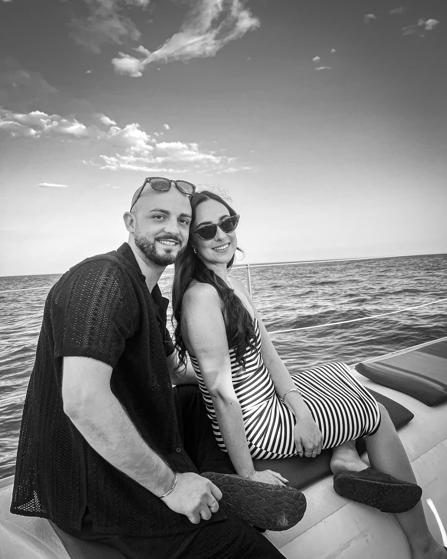 Faye and Liam on a boat in Spain