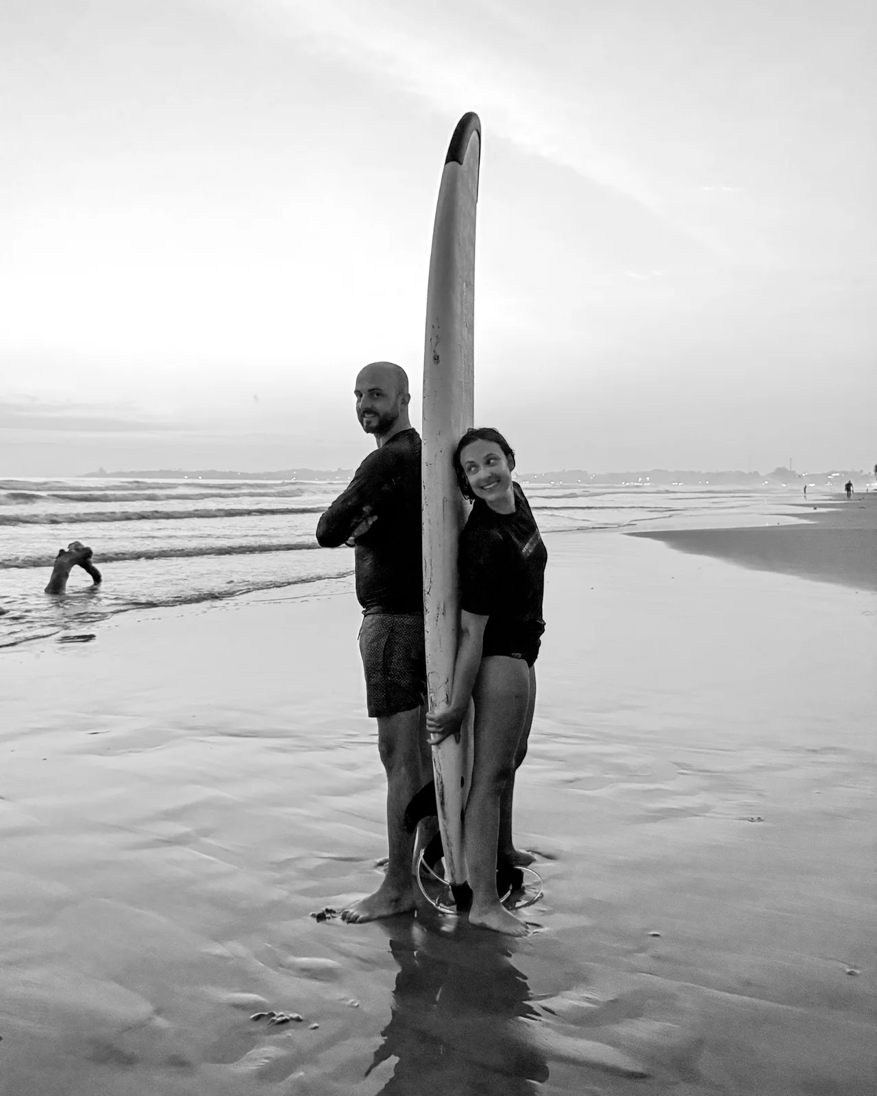 Faye and Liam with a surfboard in Sri Lanka